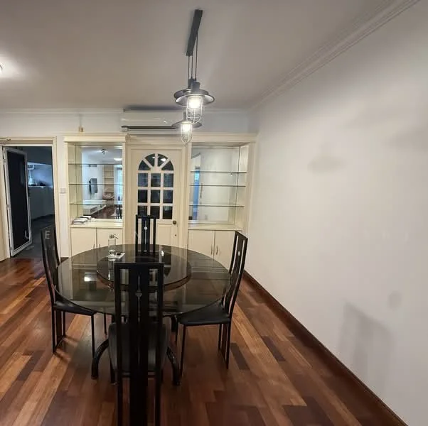 Dining features: round glass dining table, black dining chairs, wooden flooring, white painted walls, crown moulding, built-in display cabinet with glass doors, recessed downlights, wall-mounted air conditioning unit; style: modern.
