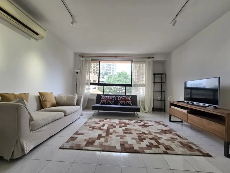 Living features: 3-seater fabric sofa in beige, 2-seater fabric sofa with Union Jack pattern, coffee table, wall-mounted TV, TV console in wood, area rug with geometric pattern, floor-to-ceiling window, curtains, 1 wall-mounted split AC, white painted walls, tile flooring; style: modern; view: city.