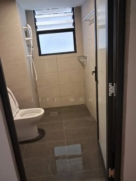 Bathroom features: white toilet, shower with handheld showerhead, glass shower screen, grey tiled walls, dark grey floor tiles, wall-mounted towel rack, small corner shelf, window for natural light; style: modern.