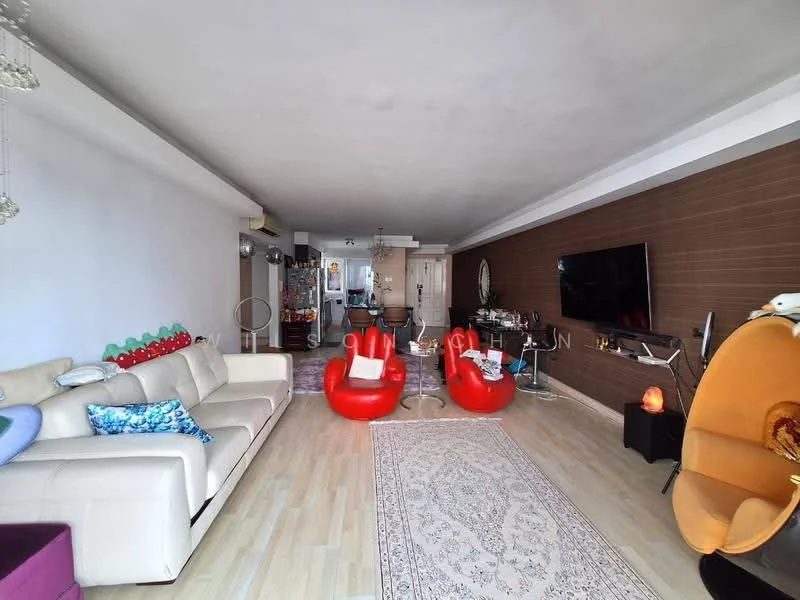 Living features: cream leather sofa, red accent chairs, area rug with intricate pattern, wood panel accent wall, wall-mounted TV, glass coffee table, decorative floor lamp, ceiling lights, large windows with natural light, open layout to kitchen, decorative wall art, light wood flooring; style: modern.