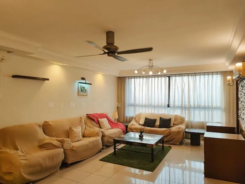 Living features: 5-blade ceiling fan with light, cream painted walls, white ceiling with crown moulding, large floor-to-ceiling windows with sheer curtains, light-colored fabric sofa, red fabric sofa, coffee table, green area rug, decorative wall shelf, stone feature wall, TV console; style: modern.