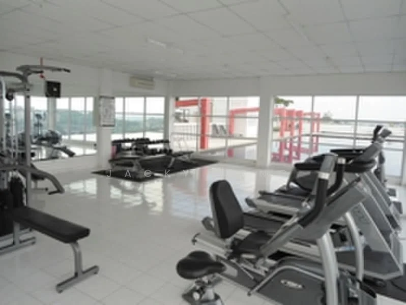 Room features: large windows providing natural light, white tiled flooring, mirrored walls, various gym equipment including treadmills and weight machines, exercise mats, air conditioning unit, open layout, view of outdoor space; style: modern; view: city.