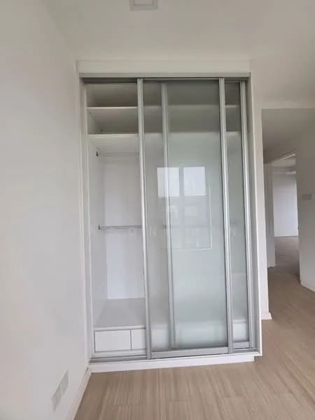 Room features: sliding glass wardrobe doors, built-in shelving, hanging rod for clothes, drawers at the bottom, light wood flooring, white painted walls; style: modern.