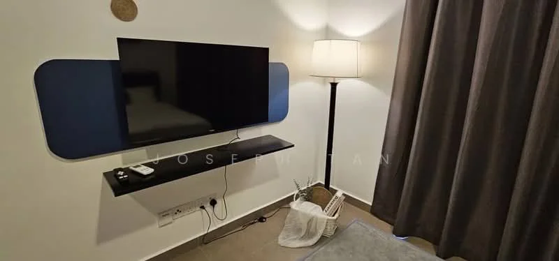Room features: wall-mounted flat-screen TV, black floating shelf, floor lamp with white shade, grey area rug, dark grey curtains, white walls, light brown flooring, decorative basket; style: modern.