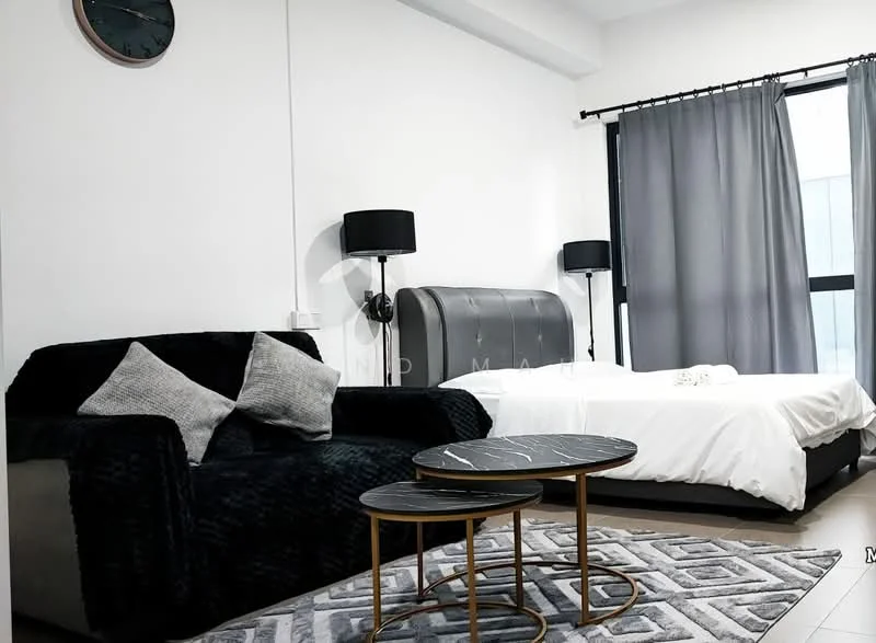Bedroom features: queen-size bed with upholstered headboard, white bedding, black fabric sofa with decorative cushions, two round coffee tables with black marble tops, area rug with geometric pattern, floor-to-ceiling windows with sheer curtains, grey curtains, wall clock, recessed lighting, wooden flooring; style: modern.