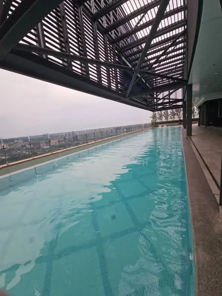 Exterior type: high-rise condominium; features: infinity pool, pool deck with loungers, glass railing, metal roof structure, city skyline view, surrounded by greenery; style: modern.