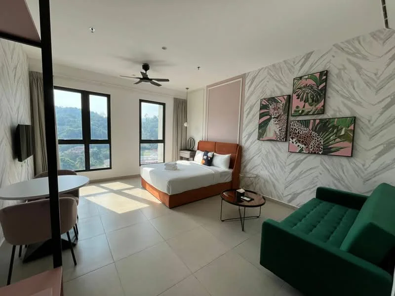 Room features: queen-size bed with upholstered headboard, 2 bedside lamps, sofa in green fabric, coffee table, wall-mounted TV, dining table for 2, floor-to-ceiling windows, curtains, decorative wall art with tropical theme, light-colored tile flooring, ceiling fan with light, wall with patterned wallpaper, neutral painted walls; style: modern; view: mountain.