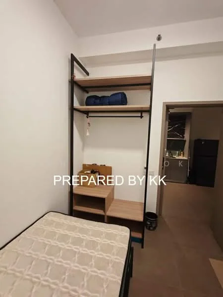 Room features: single bed, metal bed frame, mattress, open shelving unit, wooden shelves, black metal frame, clothes hanging rod, small side table, flooring in beige tiles, neutral wall color, doorway leading to another room; style: modern.