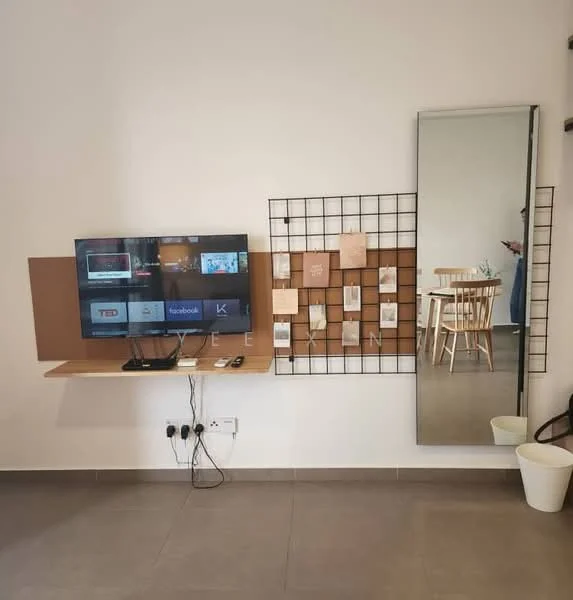 Living features: flat-screen TV mounted on wall, wooden wall-mounted shelf, grid panel for displaying items, full-length mirror, light-colored walls, grey tile flooring, wooden dining table with chairs visible in background, electrical outlets visible on wall; style: modern.