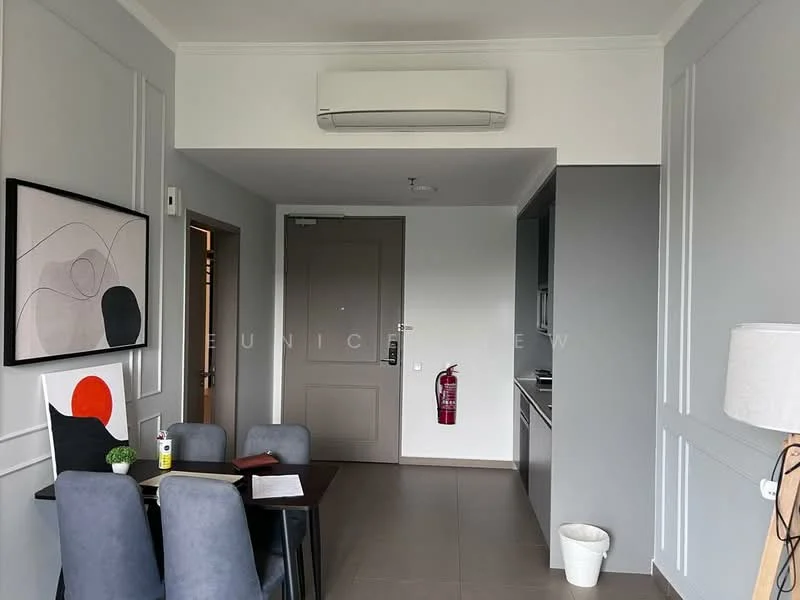 Dining features: 4-seater dining table, grey upholstered dining chairs, wall-mounted air conditioning unit, light grey painted walls, dark wood flooring, decorative wall art, fire extinguisher mounted on wall, door leading to hallway, kitchen area visible in background; style: modern.