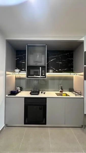 Kitchen features: grey cabinetry, black marble backsplash, white countertop, built-in microwave, freestanding gas stove, stainless-steel sink, chrome pull-down faucet, under-cabinet lighting, open shelving, kitchen utensils, dish rack; style: modern.
