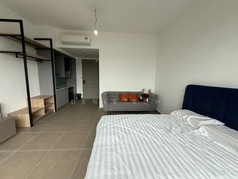 Room features: king-size bed with white striped bedding, upholstered headboard in navy blue, grey fabric sofa, wooden shelving unit, built-in kitchen cabinetry, air conditioning unit on wall, tile flooring in light beige, decorative cushions on sofa, stuffed toy on sofa, neutral wall color; style: modern.