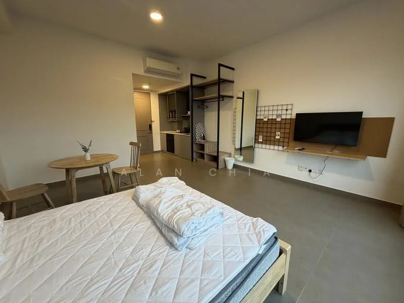 Room features: queen-size bed, white bedding, wooden bed frame, wooden dining table, two wooden chairs, wall-mounted TV, open shelving unit, air conditioning unit, tile flooring, neutral wall color, kitchenette area with cabinets, decorative wall grid; style: modern.