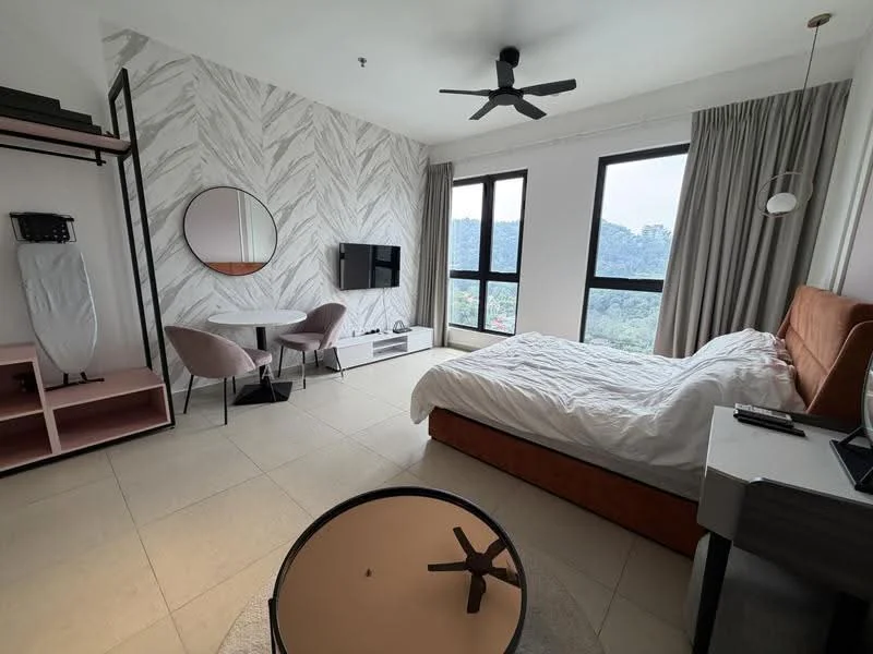 Bedroom features: king-size bed with upholstered headboard, white bedding, 2 bedside tables, wall-mounted TV, round mirror, ceiling fan, floor-to-ceiling windows, curtains, light grey accent wall with geometric pattern, light grey tile flooring, small round coffee table, 2 pink upholstered chairs, TV console; style: modern; view: mountain.
