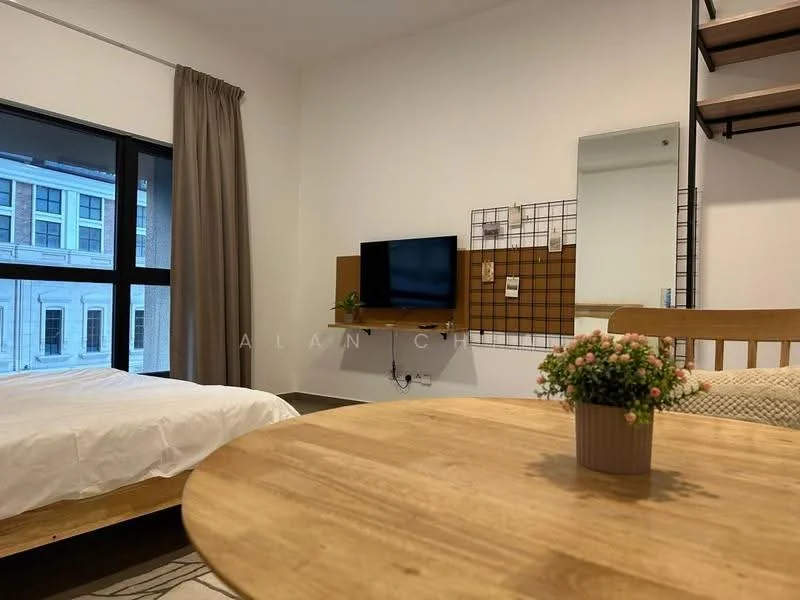 Bedroom features: queen-size bed with white bedding, wooden bed frame, floor-to-ceiling windows, grey curtains, wall-mounted TV, wooden wall panel with corkboard, mirror, wooden dining table, wooden chairs, decorative plant on table, light-colored walls, exposed shelving unit; style: modern; view: city.