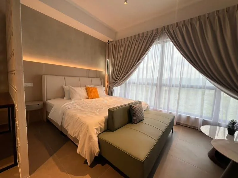 Bedroom features: king-size bed with upholstered headboard, white bedding, orange throw pillow, floor-to-ceiling windows, sheer curtains, grey accent wall, recessed lighting, laminate flooring, green upholstered bench, round coffee table, decorative plant on table; style: modern; view: garden.