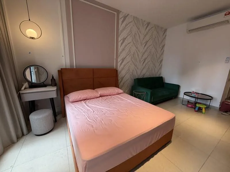 Bedroom features: queen-size bed with pink bedding, upholstered headboard, green fabric sofa, round side table, vanity table with mirror, white stool, wall-mounted air conditioning unit, light fixture with pendant design, textured accent wall, cream tiled flooring, curtains, decorative wall paneling; style: modern.