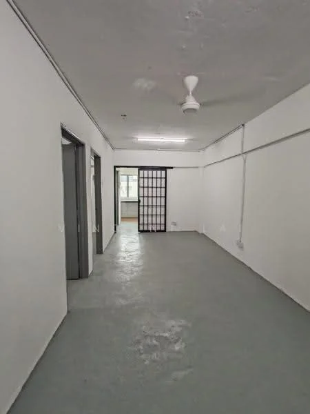 Room features: white painted walls, grey concrete flooring, ceiling fan, doorway leading to another room, partition wall with sliding door, exposed ceiling, light fixture, power outlet; style: minimalist.