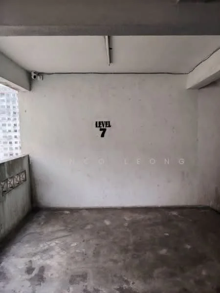 Room features: concrete flooring, plain white walls, ceiling with exposed beams, no visible windows or doors, level indicator on wall.