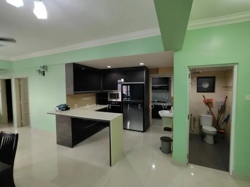 Kitchen features: black cabinetry, white countertop, stainless-steel fridge, built-in oven, freestanding range oven, ceramic tile flooring, recessed downlights, open shelving, kitchen island with seating, grey accent wall; style: modern. Room features: cream painted walls, doorway to bathroom, ceramic tile flooring, toilet, cleaning tools visible.