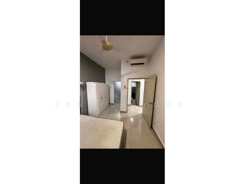 Room features: white painted walls, grey accent wall, tile flooring, ceiling fan, wall-mounted split AC, refrigerator, door, mirror, kitchen countertop.