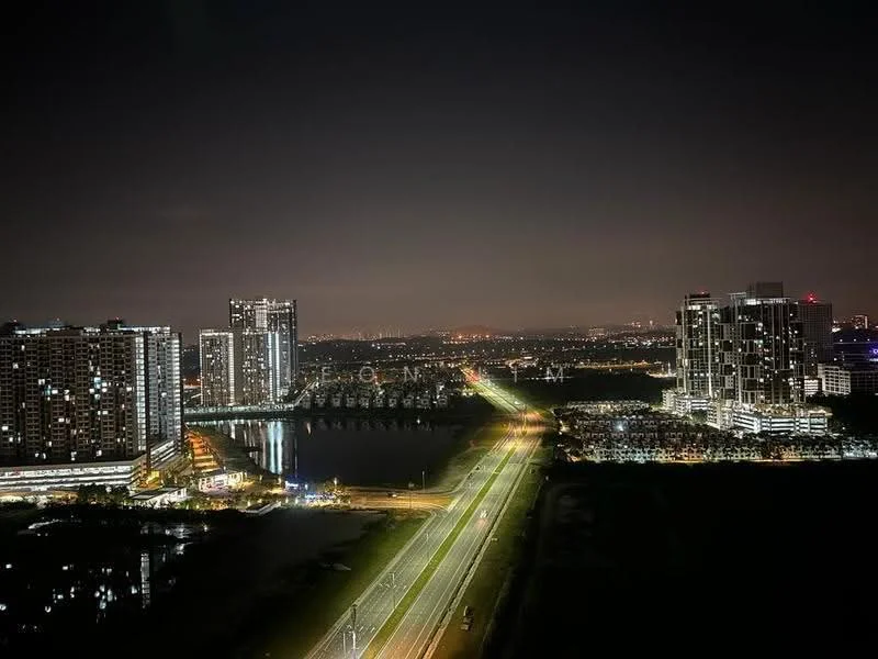 Exterior type: high-rise condominium; features: city skyline view, night lighting, surrounding water body, main road, multiple high-rise buildings, urban landscape; style: modern.