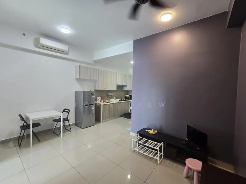 Living features: white painted walls, grey accent wall, glossy tile flooring, 5-blade ceiling fan with light, wall-mounted TV, black TV console, small pink stool, open shelving unit, dining table with two chairs; style: modern. Kitchen features: stainless-steel fridge, built-in cabinets, countertop with kitchen appliances, ceramic tile backsplash, open layout to living area; style: modern.