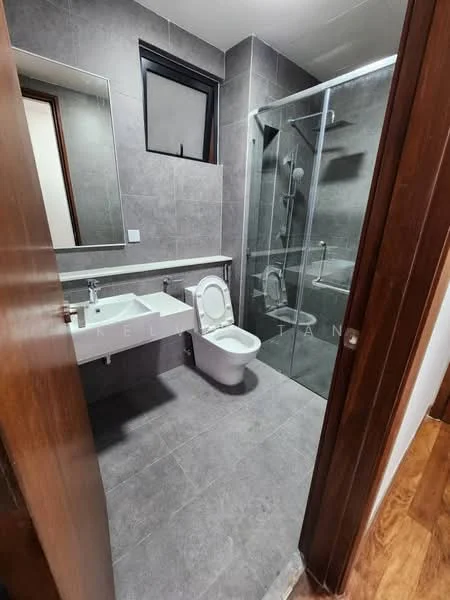 Bathroom features: grey tiled walls, grey tiled flooring, single-sink vanity with white cabinet, framed mirror, walk-in shower with glass enclosure, chrome shower head, toilet, window for natural light; style: modern.