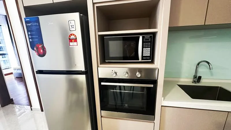 Kitchen features: stainless-steel fridge, built-in microwave, built-in oven, stainless-steel sink, chrome pull-down faucet, light-colored cabinetry, white countertop, glass backsplash; style: modern.