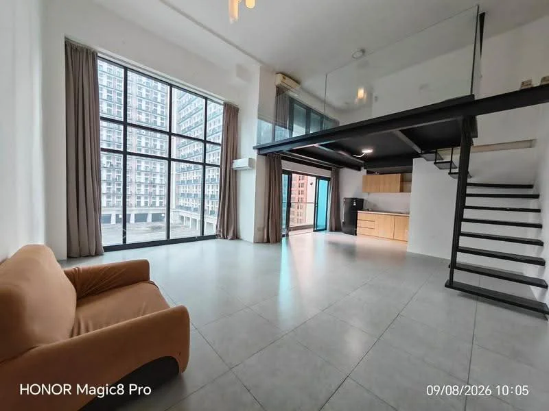 Living features: large floor-to-ceiling windows, grey tiled flooring, white painted walls, exposed ceiling beams, black metal staircase, sofa in beige fabric, curtains in light brown, open layout, kitchen area visible in background, air conditioning unit mounted on wall; style: modern; view: city.