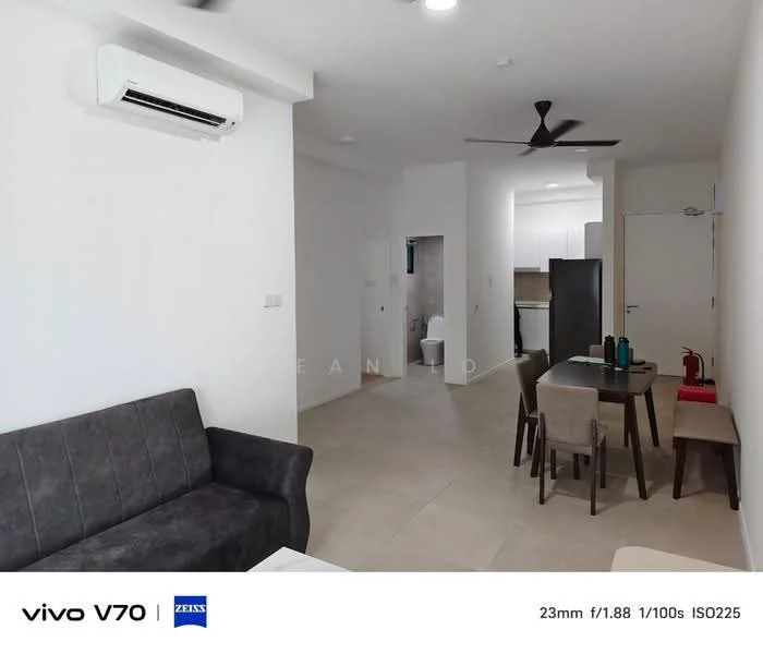 Living features: grey fabric sofa, coffee table, wall-mounted TV, 5-blade ceiling fan, wall-mounted split AC, tile flooring, white painted walls, decorative wall art, dining table with chairs, open layout, natural light from windows; style: modern. Room features: tile flooring, white painted walls, doorway to bathroom, doorway to kitchen.