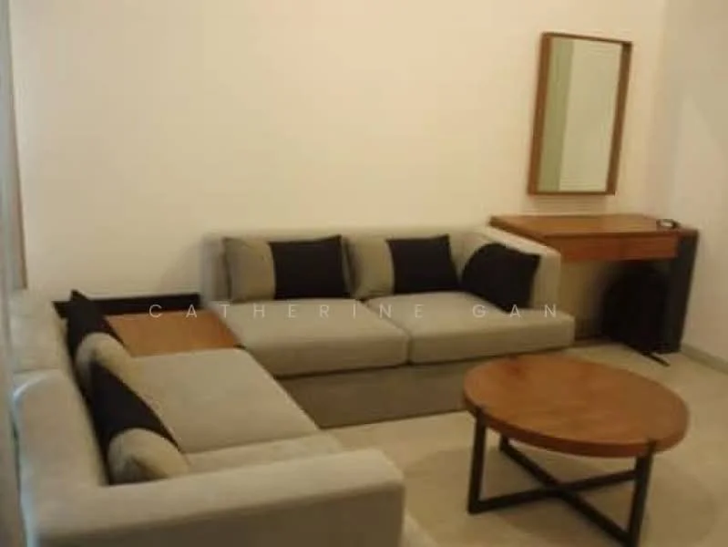 Living features: L-shape sectional sofa in grey with black cushions, wooden coffee table, wooden console table, framed mirror on the wall, cream painted walls, tile flooring, decorative wall clock; style: modern.