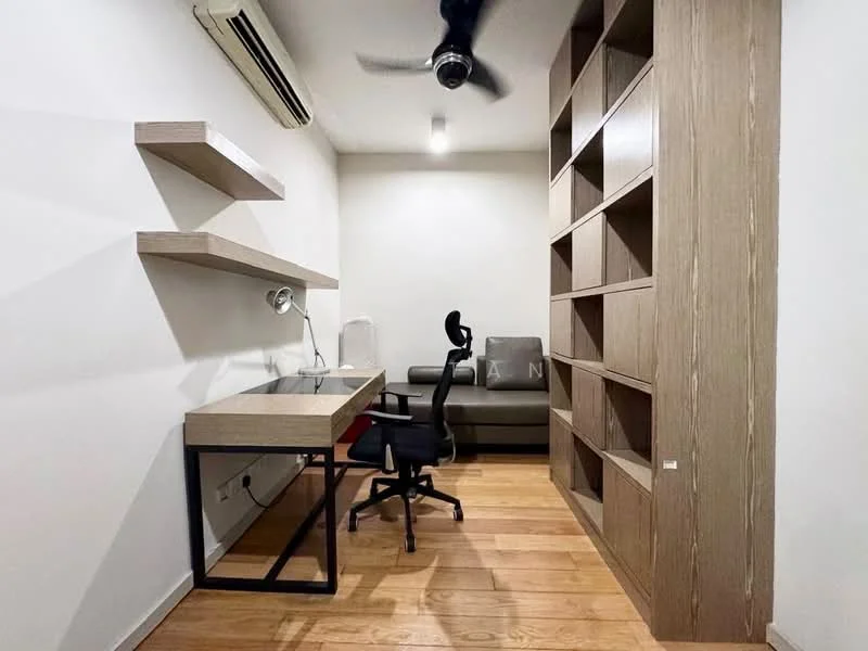 Study features: wooden flooring, white painted walls, 1 wall-mounted split AC, 5-blade ceiling fan, desk with black metal frame, wooden shelves, black office chair, built-in bookshelf, sofa, decorative items on shelves; style: modern.