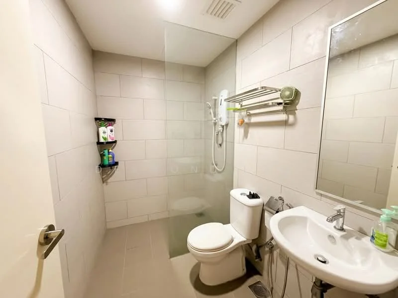 Bathroom features: glass shower enclosure, wall-mounted shower head, handheld shower, chrome towel rail, single-sink vanity with white cabinet, chrome basin mixer, framed mirror, one-piece toilet, grey tiled walls, light grey tile flooring, shelf with toiletries; style: modern.