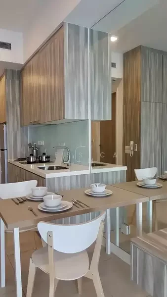 Dining features: light wood dining table, white dining chairs, set of 4 dining plates, set of 4 dining bowls, cutlery set, kitchen cabinetry with wood finish, stainless-steel sink, kitchen countertop, refrigerator visible in background, mirrored wall, neutral tile flooring; style: modern.