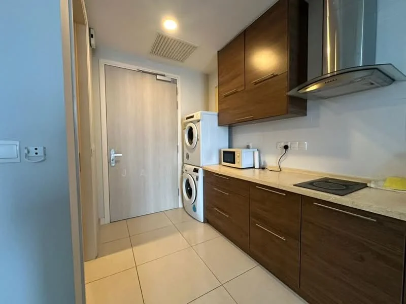 Kitchen features: brown wooden cabinetry, white countertop, built-in stove, microwave, stacked washer and dryer, tile flooring, recessed ceiling lights, door to hallway; style: modern.