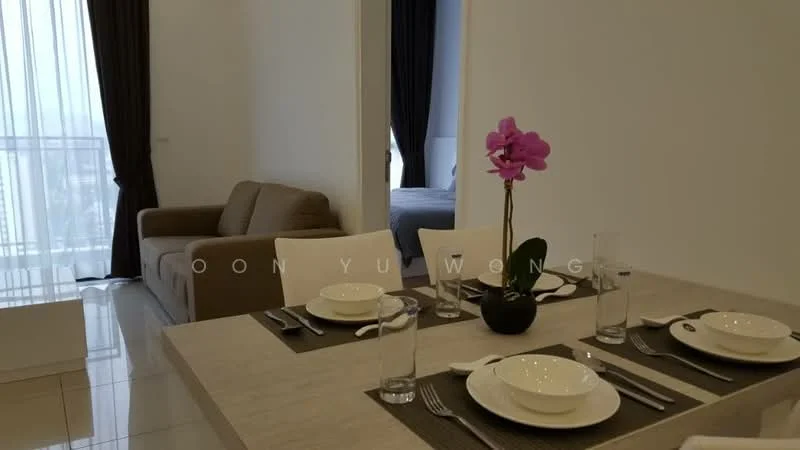 Dining features: dining table with beige surface, 4 white plates, 4 glasses, 4 sets of cutlery, decorative black pot with orchid plant, grey placemats; style: modern. Living features: beige fabric sofa, floor-to-ceiling windows with sheer curtains, white walls, glossy tile flooring; style: modern. Bedroom features: bed visible through doorway, unknown bedding, white walls.