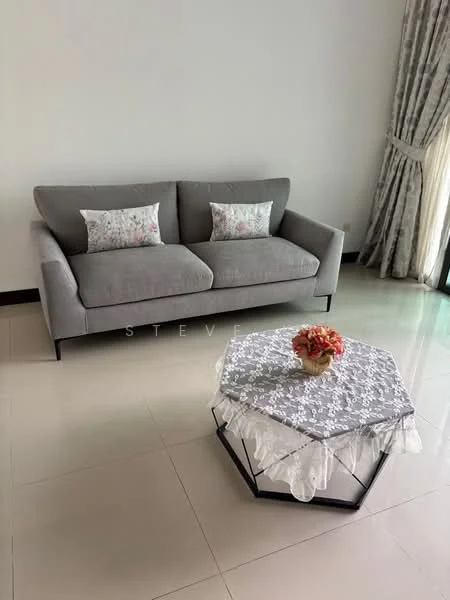 Living features: 3-seater fabric sofa in grey, decorative cushions with floral pattern, hexagonal coffee table with lace overlay, ceramic vase with flowers, white walls, large windows with sheer curtains, glossy tile flooring, recessed lighting; style: modern.