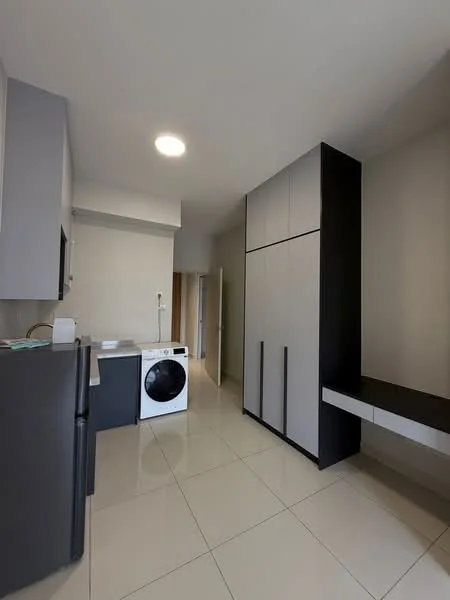 Kitchen features: grey cabinetry, black cabinetry, white washing machine, stainless-steel fridge, white countertop, tile flooring, recessed ceiling light, built-in storage unit, open layout; style: modern.