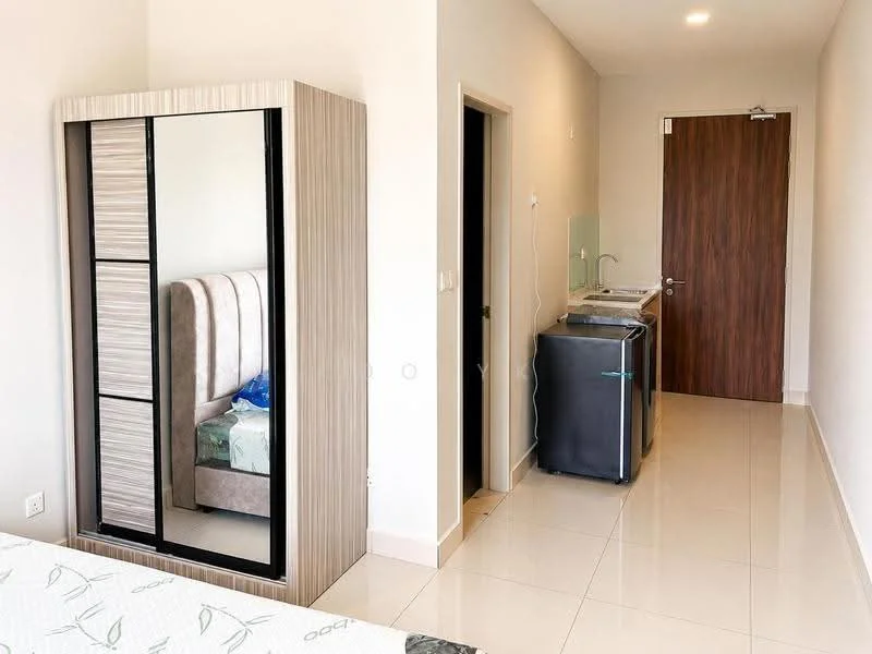 Room features: cream painted walls, glossy tile flooring, built-in wardrobe with mirrored doors, queen-size bed with upholstered headboard, kitchenette with sink, mini fridge, wooden door, light ceiling, wall-mounted electrical outlets; style: modern.