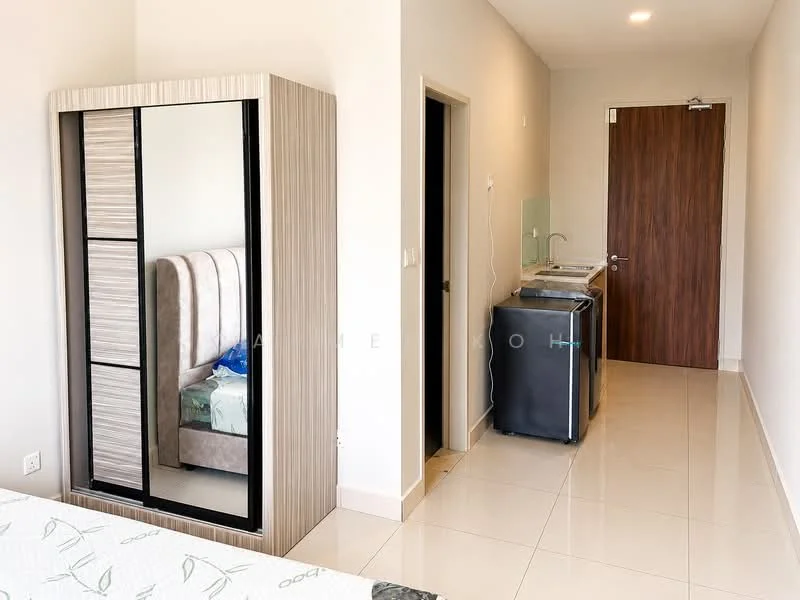Room features: light-colored painted walls, glossy tile flooring, built-in wardrobe with mirrored doors, queen-size bed with upholstered headboard, kitchenette with sink, small fridge, door leading to hallway, recessed ceiling lights; style: modern.