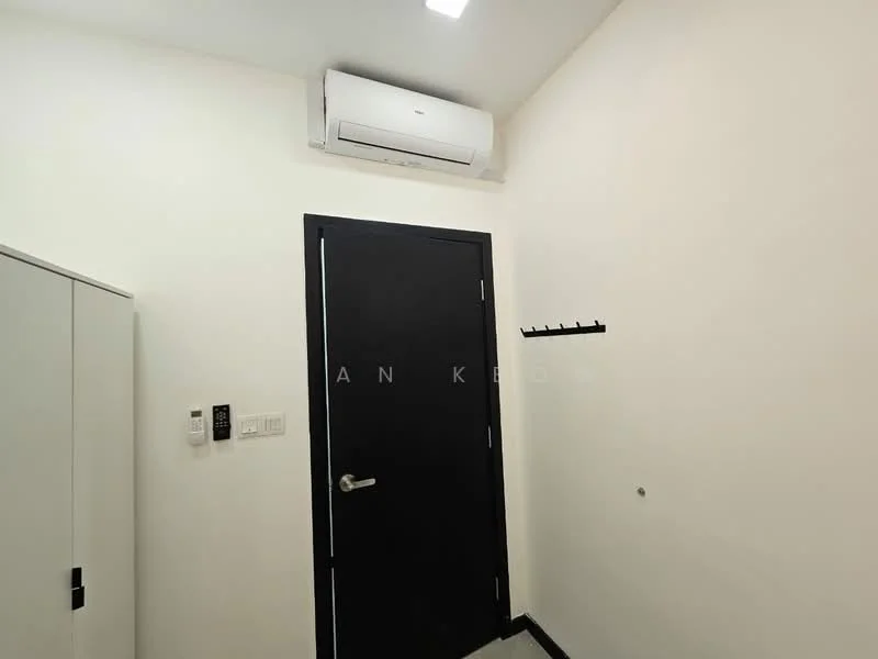 Room features: white painted walls, black door, 1 wall-mounted split AC, light ceiling, coat rack on wall, grey flooring, electrical outlets, intercom panel; style: modern.