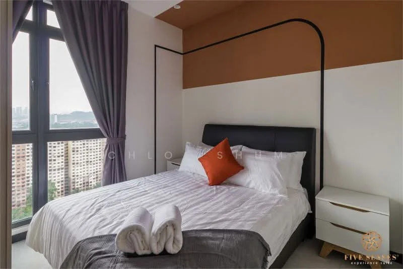 Bedroom features: queen-size bed, upholstered headboard, white bedding, orange accent pillow, nightstand with drawer, floor-to-ceiling window, curtains in grey, decorative towels, painted accent wall in orange, white painted walls, laminate flooring; style: modern; view: city.