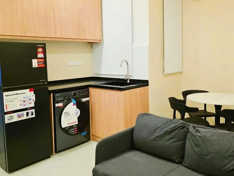 Kitchen features: black granite countertop, wood cabinetry in light brown, stainless-steel single-bowl sink, chrome pull-down faucet, black built-in oven, black washing machine, stainless-steel fridge, round dining table, 4 black dining chairs, grey fabric sofa, light-colored flooring, window with white blinds; style: modern.