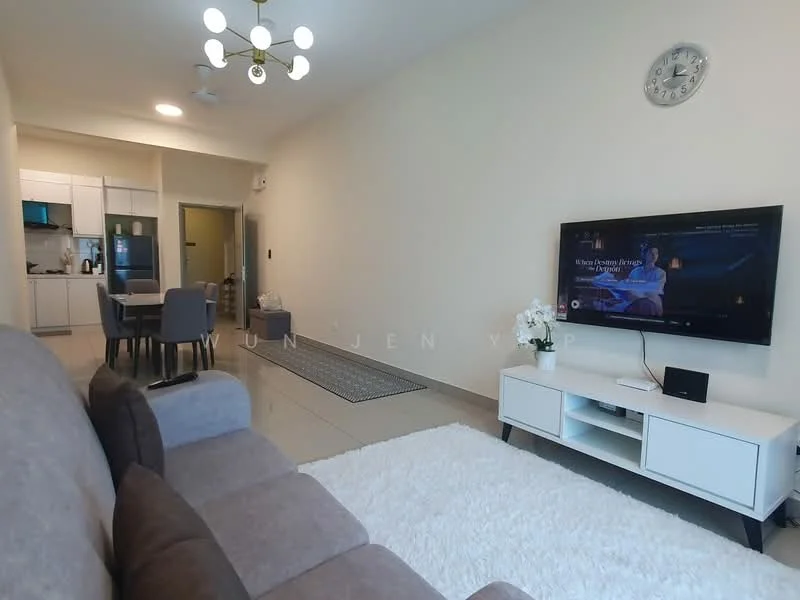 Living features: 3-seater fabric sofa in grey, area rug with geometric pattern, wall-mounted TV, TV console in white, ceiling light fixture with multiple bulbs, wall clock, cream painted walls, tile flooring, sliding glass door, decorative plant in ceramic pot; style: modern. Dining features: 4-seater dining table, upholstered dining chairs in grey, open kitchen area visible, kitchen cabinetry in white; style: modern.