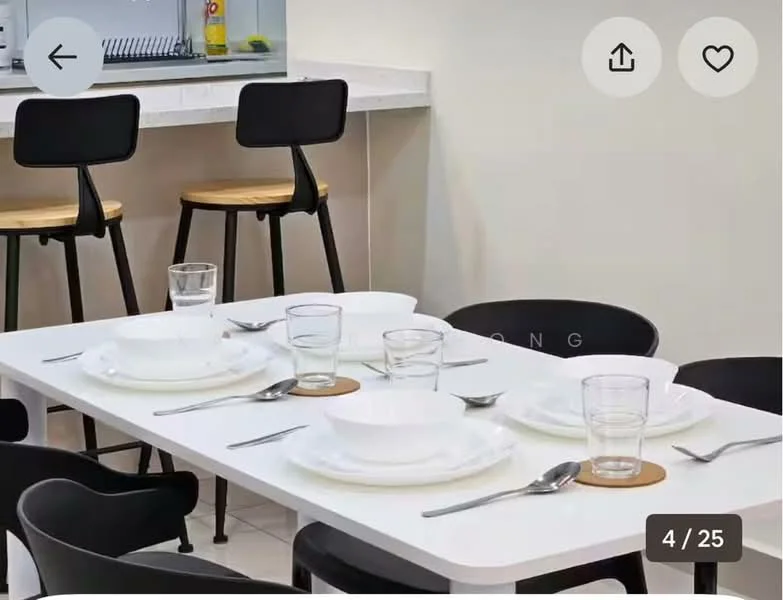 Dining features: white dining table, black dining chairs, wooden seat on chairs, set of white plates, set of clear glasses, set of stainless-steel cutlery, coaster under glasses, neutral wall color, tile flooring; style: modern.