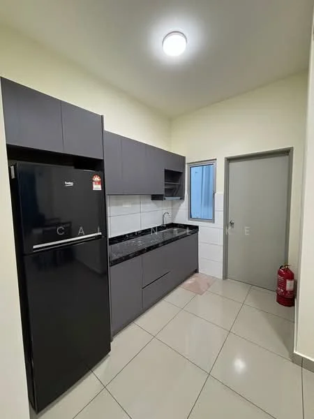 Kitchen features: black refrigerator, grey cabinetry, black countertop, white tiled backsplash, stainless-steel sink, single-bowl sink, chrome faucet, wall-mounted light fixture, ceramic tile flooring, window with white frame, fire extinguisher, door to adjacent room; style: modern.