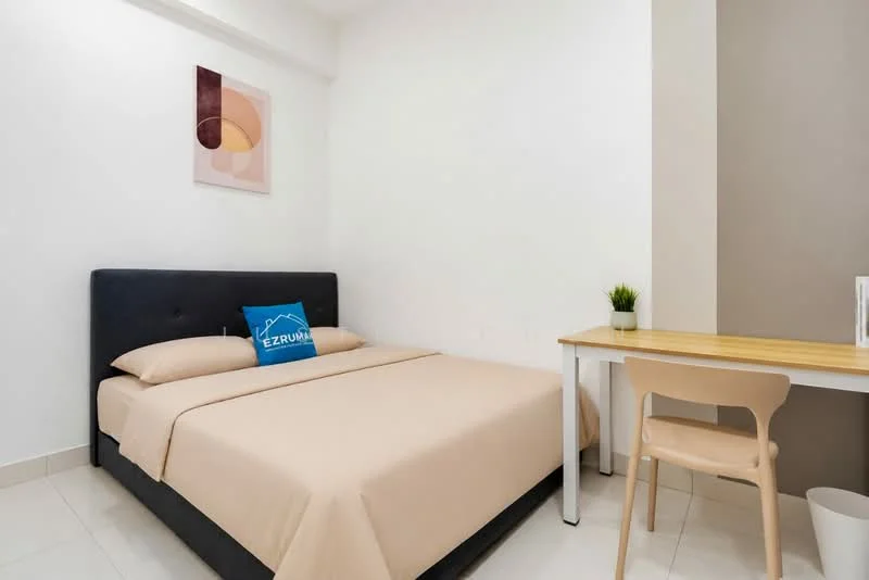 Bedroom features: queen-size bed with beige bedding, upholstered headboard, wooden study desk, plastic chair, framed artwork on wall, small potted plant, white painted walls, light-colored tile flooring, window with natural light; style: modern.