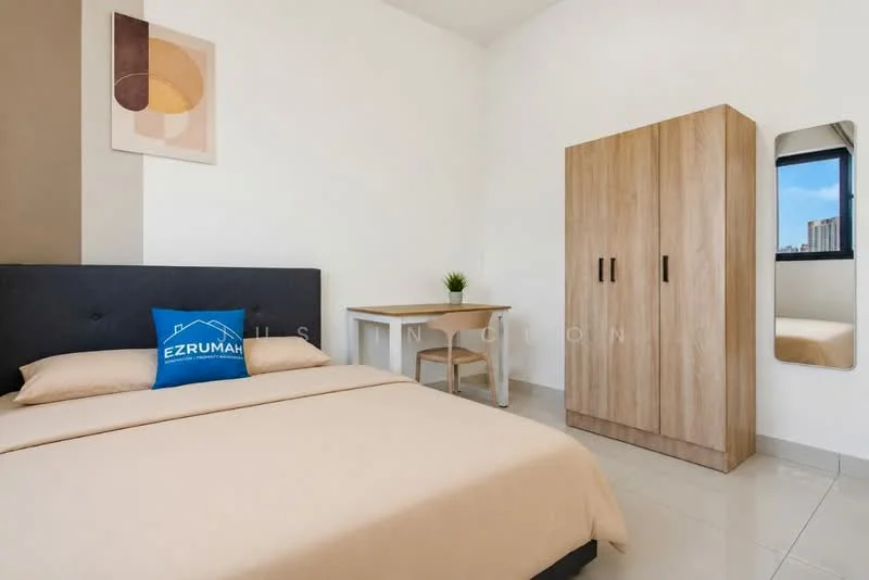 Bedroom features: queen-size bed with beige bedding, upholstered headboard in dark grey, wooden wardrobe with two doors, study desk with wooden surface, chair with wooden legs, mirror on the wall, cream painted walls, glossy tile flooring, window with city view, decorative wall art; style: modern; view: city.