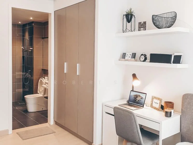 Study features: white desk, grey upholstered chair, laptop on desk, decorative plant, shelf with decorative items, framed photo, table lamp, built-in wardrobe with sliding doors; style: modern. Bathroom features: toilet, shower with glass enclosure, grey tiled walls, dark tiled flooring, sink with vanity; style: modern.
